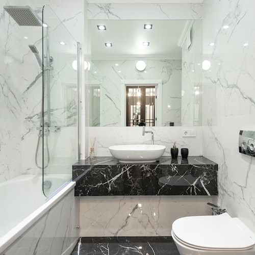 Glass railing shower enclosure marble