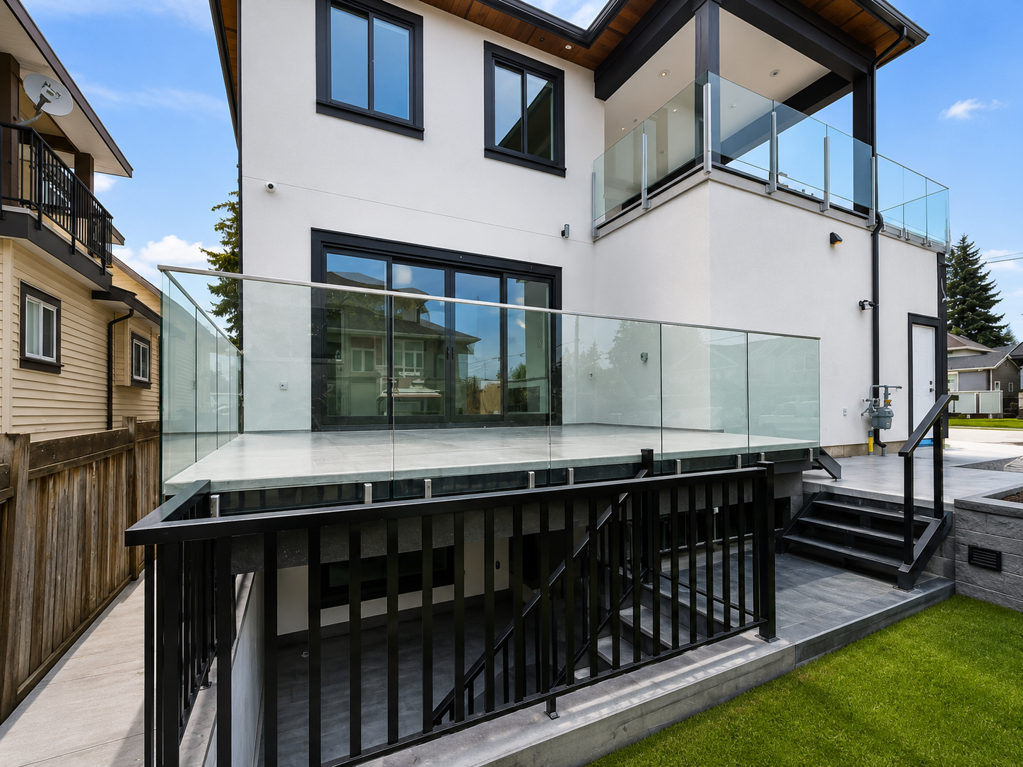 Frameless glass deck railing on two-storey modern home in Kitsilano Vancouver by Wintek Glass